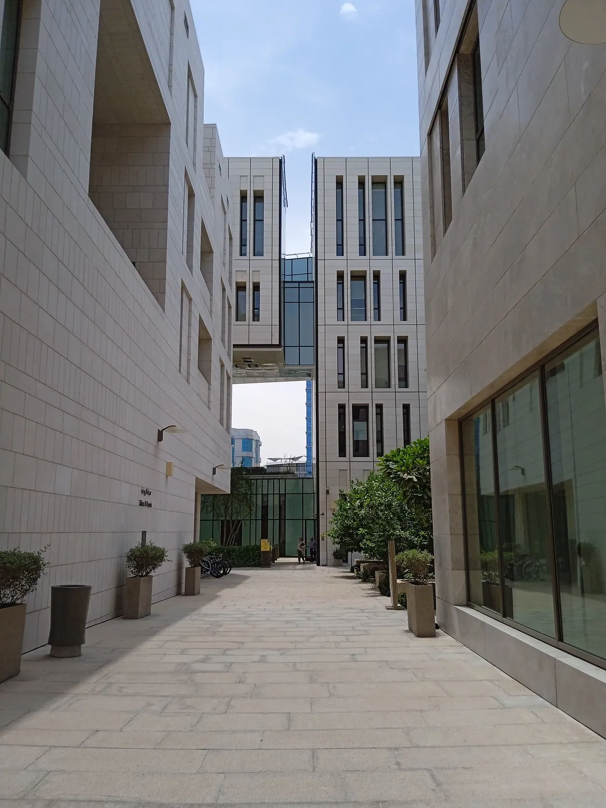 A pedestrian passage between stone buildings in Msheireb Downtown Doha