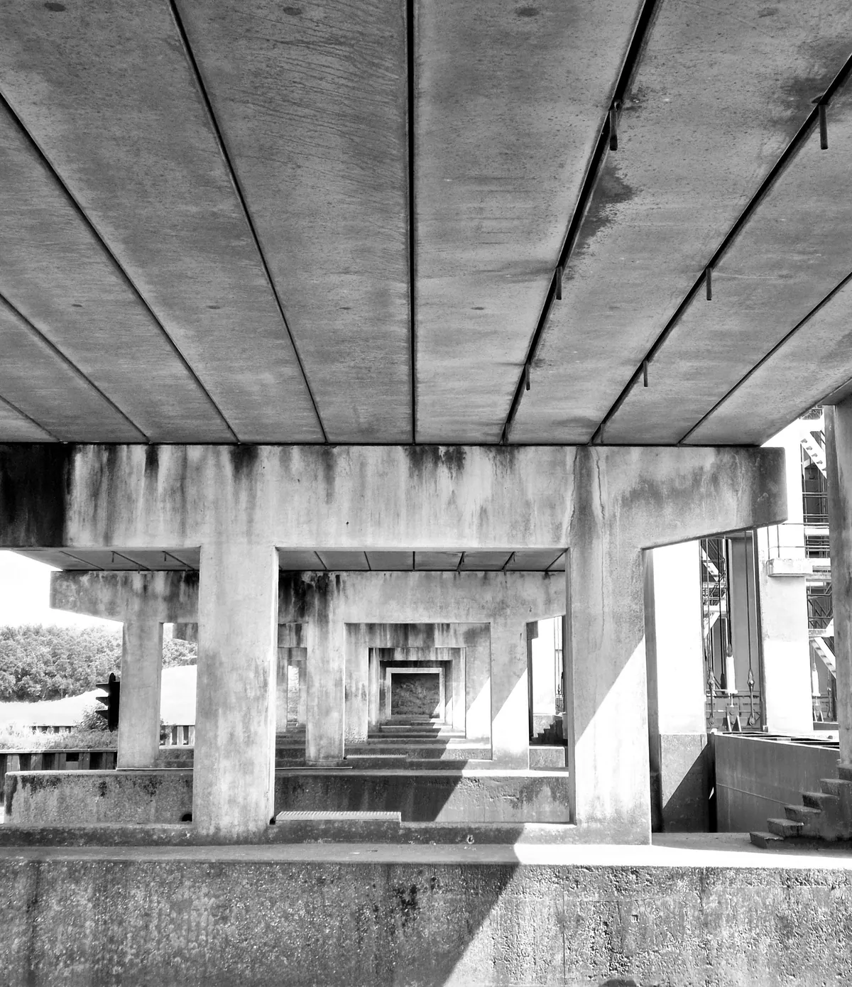 Repeated concrete frames form a receding series of openings